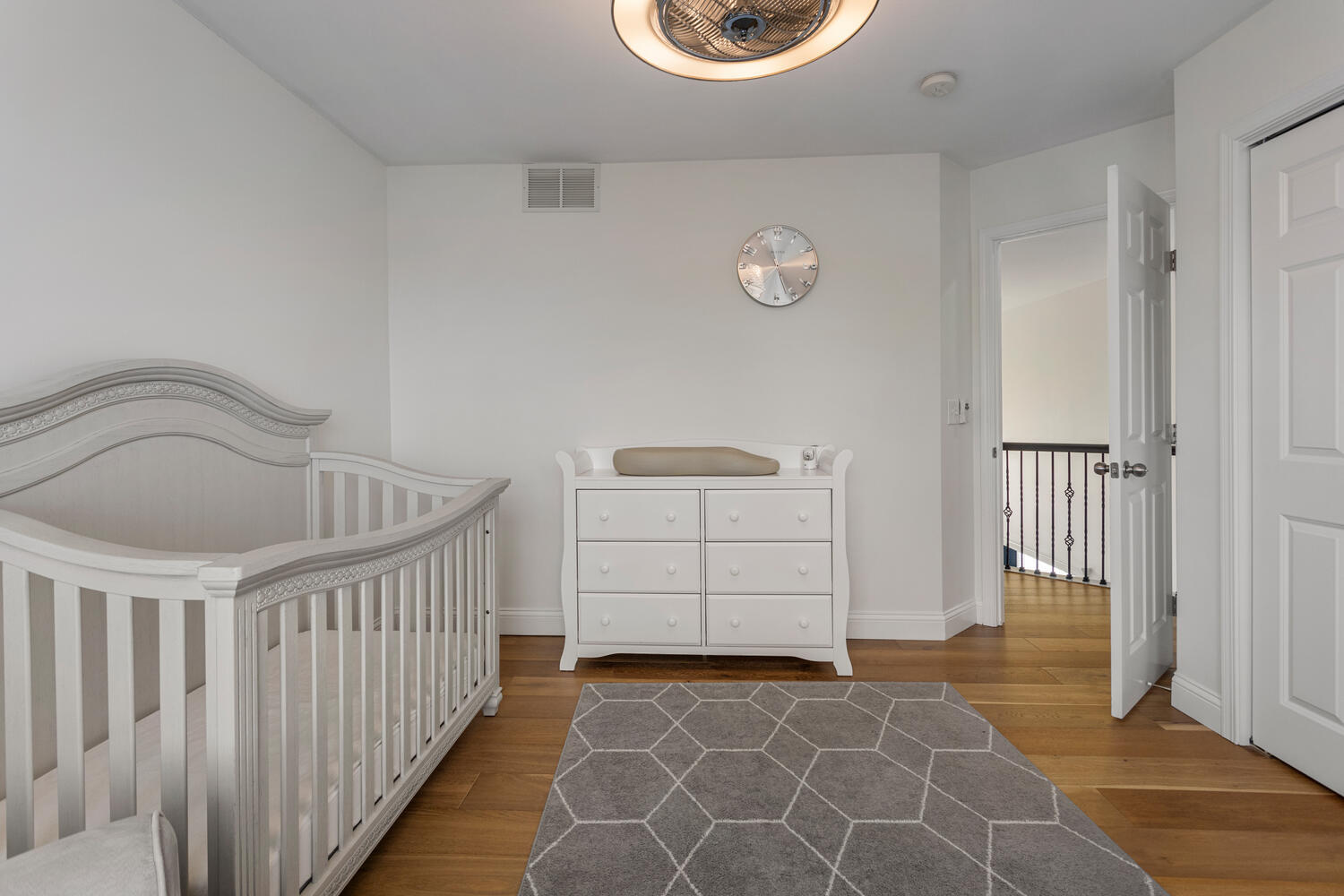 1621 English Oak Drive Champaign, IL 61822 - Photo 31 of 62 a view of a bedroom with wooden floor and white walls