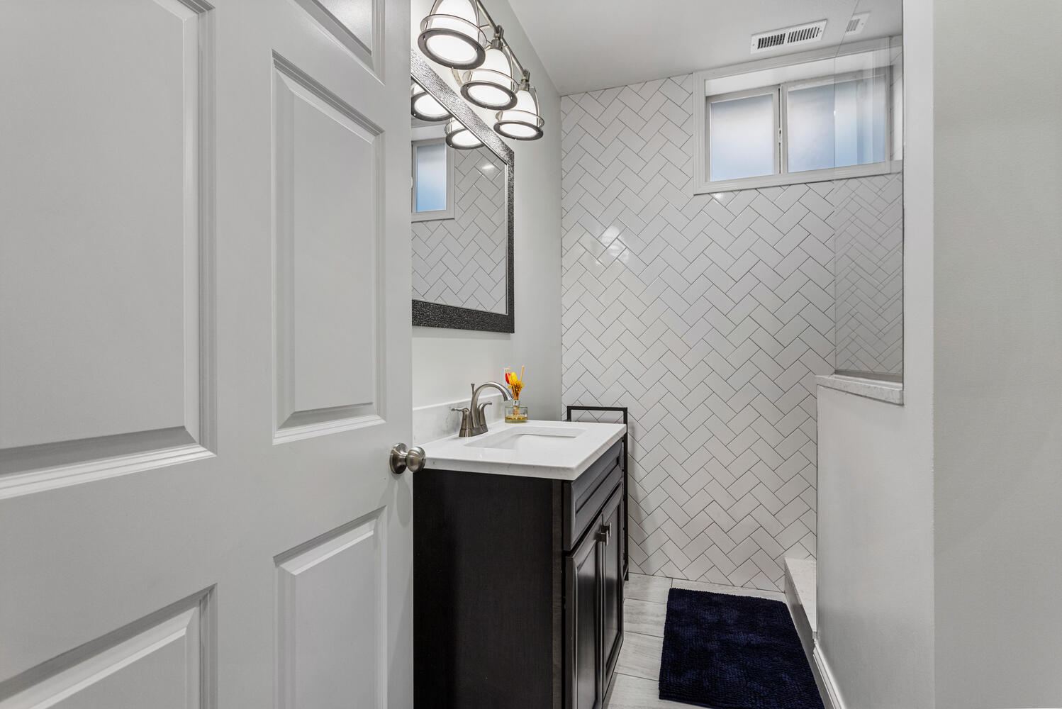 1621 English Oak Drive Champaign, IL 61822 - Photo 42 of 62 a bathroom with a sink a light fixture and a mirror