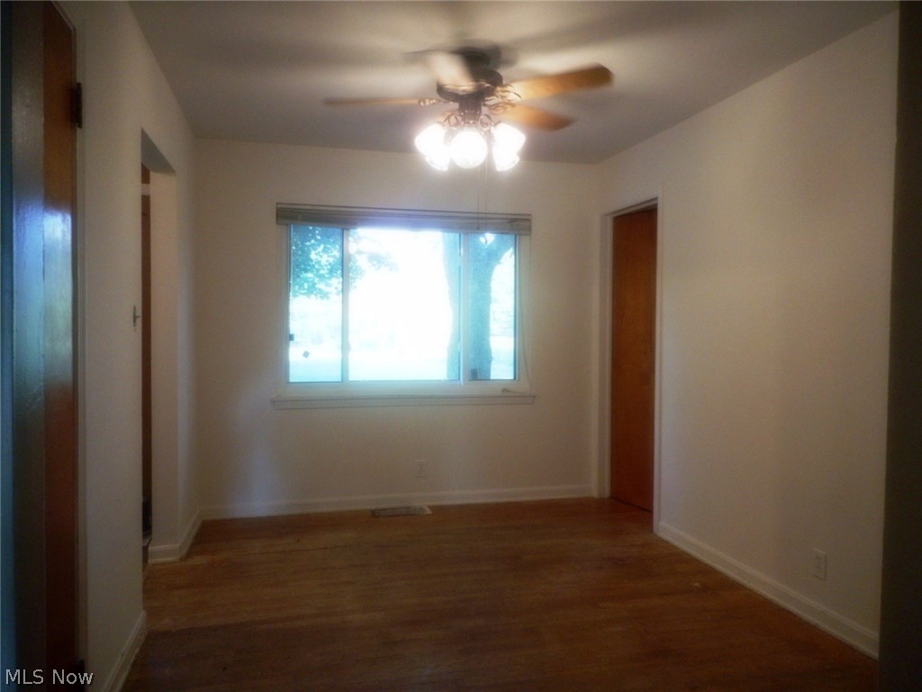 908 Jacoby Road Akron, OH 44321 - Photo 10 of 24 Dining room with hardwood floors and large picture window viewing the backyard