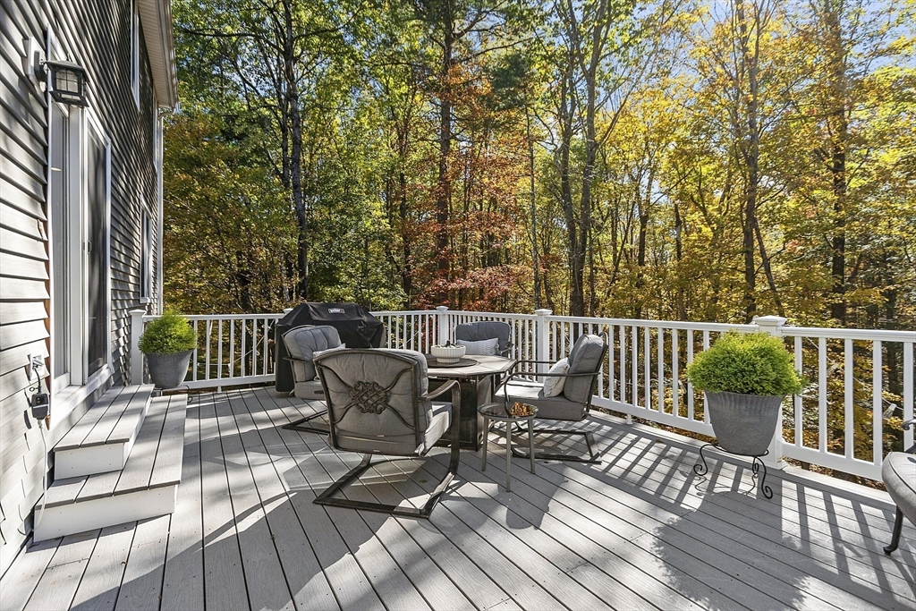 4 Celestial Way Pepperell, MA 01463 - Photo 16 of 41 a view of a deck with furniture and wooden floor