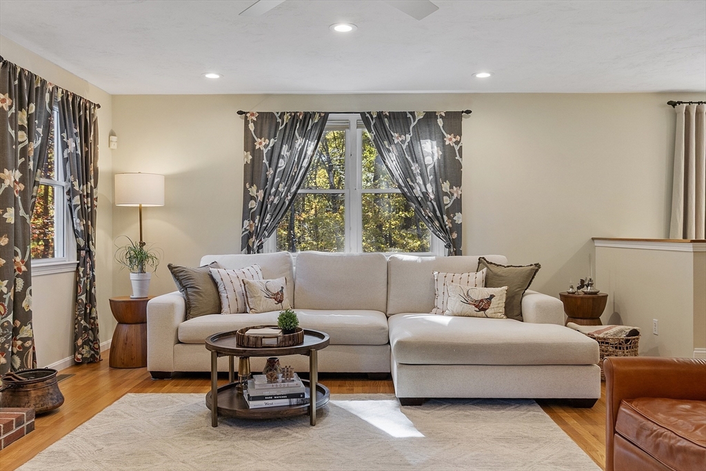 4 Celestial Way Pepperell, MA 01463 - Photo 17 of 41 a living room with furniture and a large window