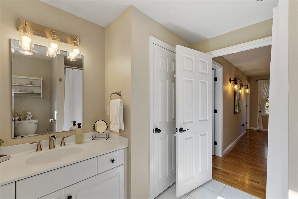 4 Celestial Way Pepperell, MA 01463 - Photo 31 of 41 a en suite bathroom with a granite countertop sink mirror and shower