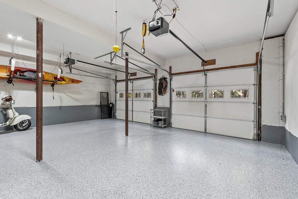 4 Celestial Way Pepperell, MA 01463 - Photo 38 of 41 a view of a garage with white cabinets
