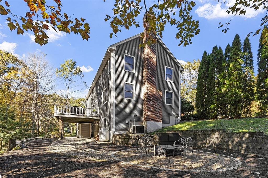 4 Celestial Way Pepperell, MA 01463 - Photo 39 of 41 a view of a building with a yard