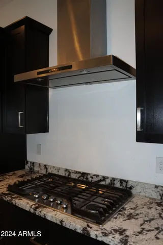 a close up of a stove top oven sitting inside of a kitchen
