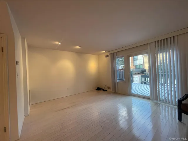 a kitchen with a refrigerator a stove top oven a sink dishwasher and a refrigerator with wooden floor