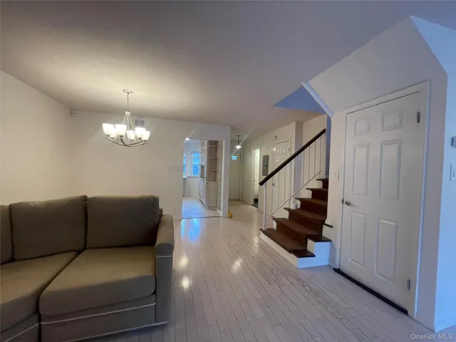 a view of a living room and a chandelier