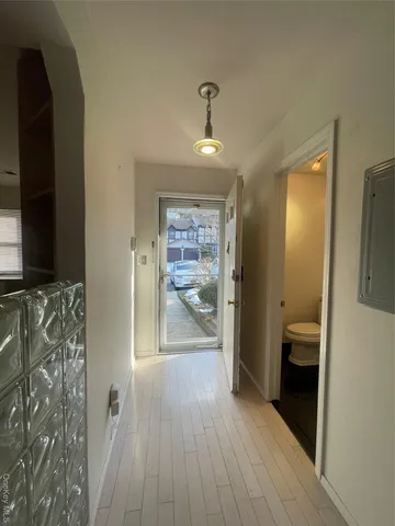 a view of entryway with wooden floor