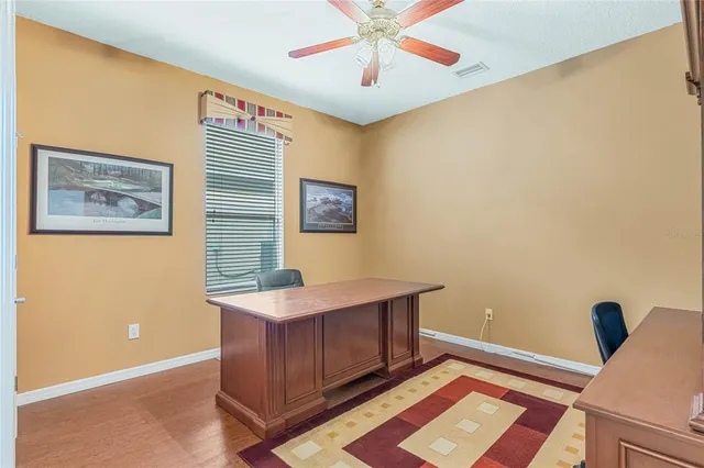 a bathroom with a sink and mirror with toilet