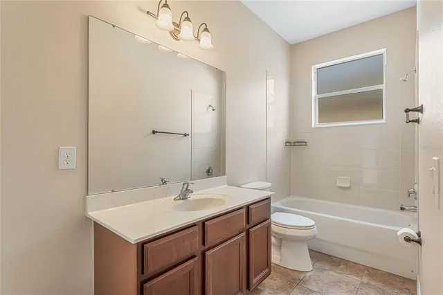 a view of a hallway with wooden floor and stairs