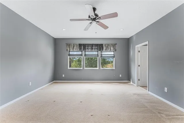 a bathroom with a tub a double vanity sink and a mirror