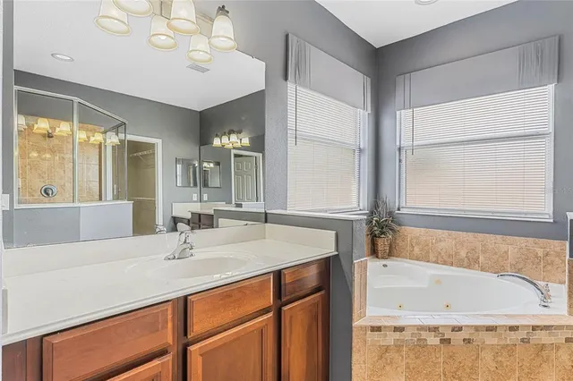 a bathroom with a shower and a glass door