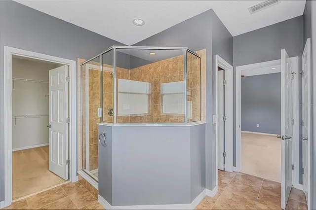 a bathroom with a sink a double vanity and a mirror