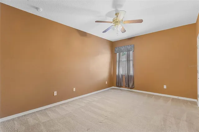 a view of swimming pool with an outdoor seating