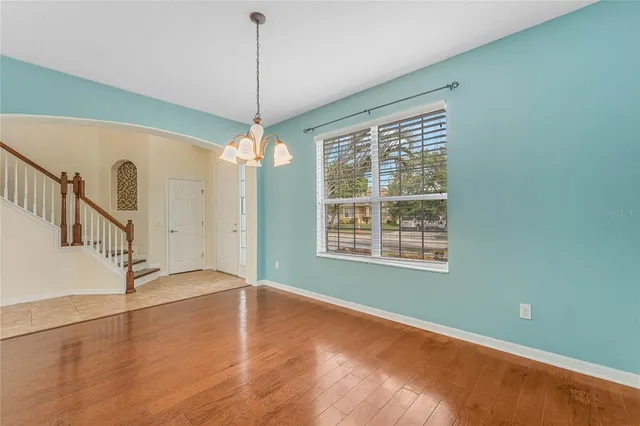 a kitchen with stainless steel appliances granite countertop a refrigerator a sink a stove a microwave and island