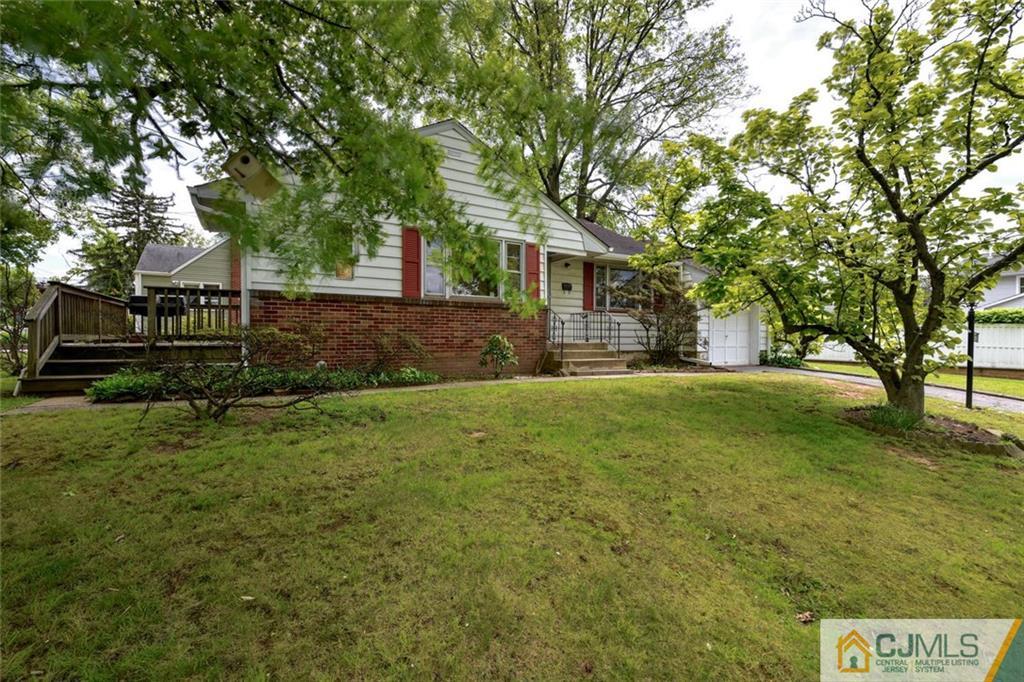 65 Long Hill Road Colonia, NJ 07067 - Photo 2 of 16 a view of a yard with plants and trees
