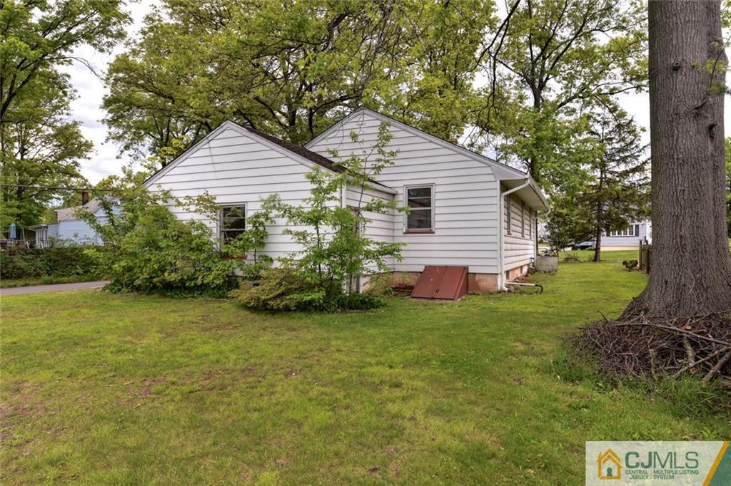 65 Long Hill Road Colonia, NJ 07067 - Photo 16 of 16 a front view of a house with a garden