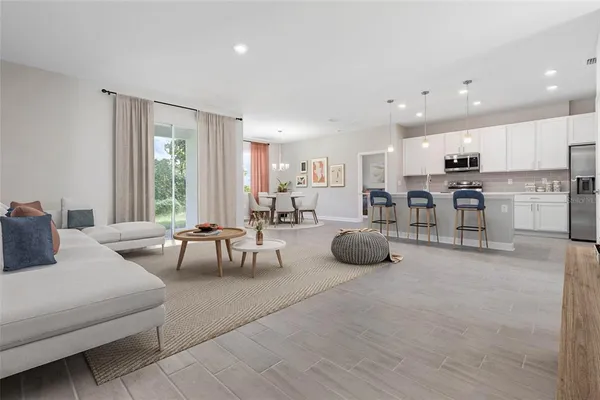 a living room with furniture and a table