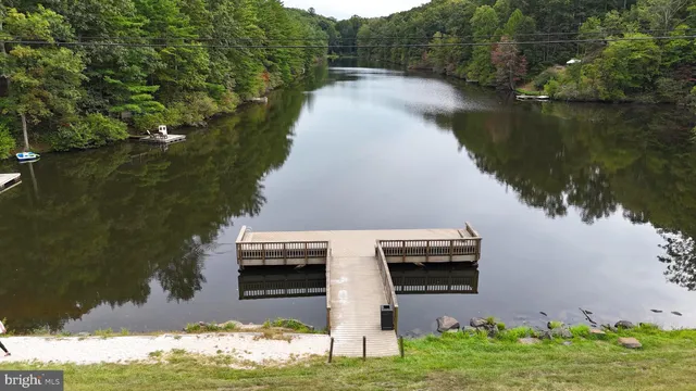 a view of a lake with a house in the background