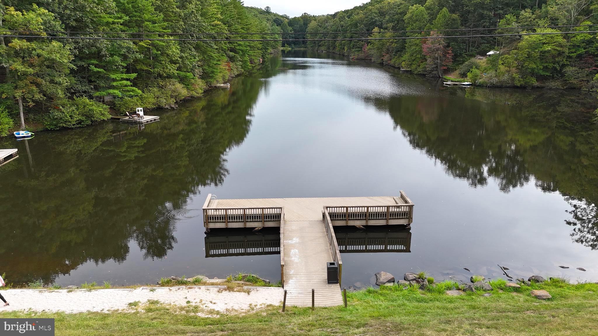 Fawn Run Hedgesville, WV 25427 - Photo 5 of 16 a view of a lake with a house in the background