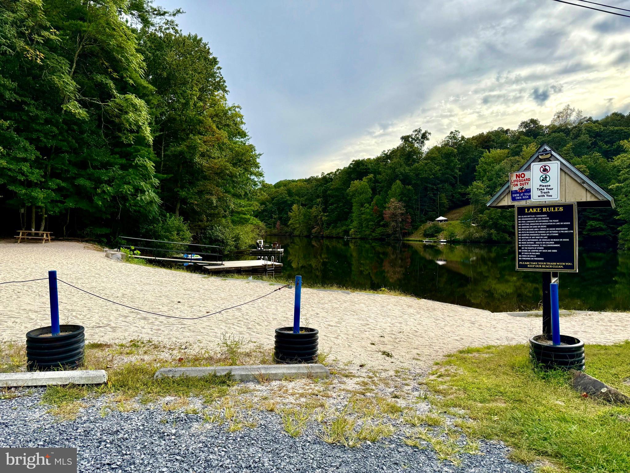 Fawn Run Hedgesville, WV 25427 - Photo 6 of 16 a swimming pool with some trees in the background