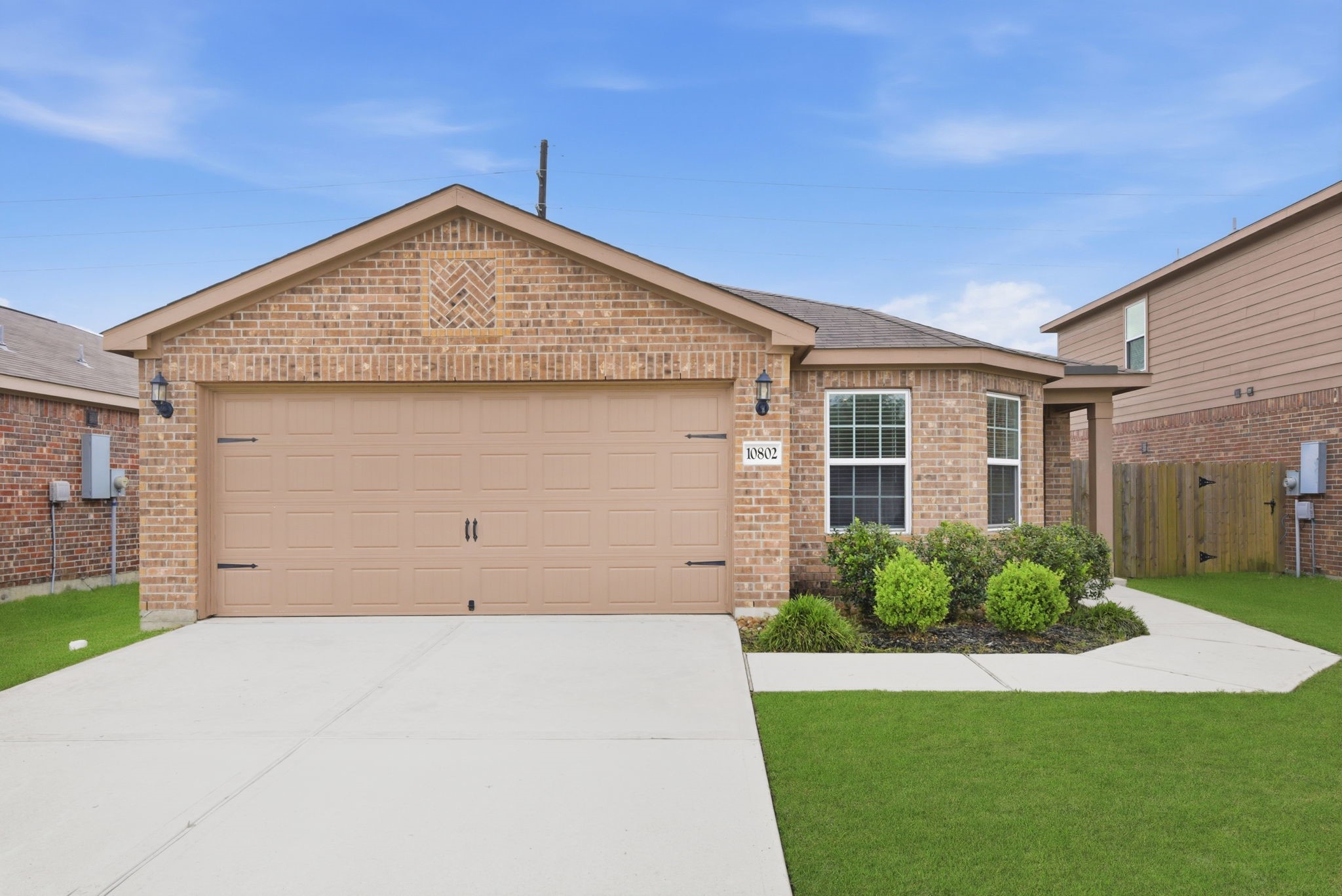 10802 Spring Brook Pass Drive Humble, TX 77396 - Photo 2 of 22 Front view with garage area.