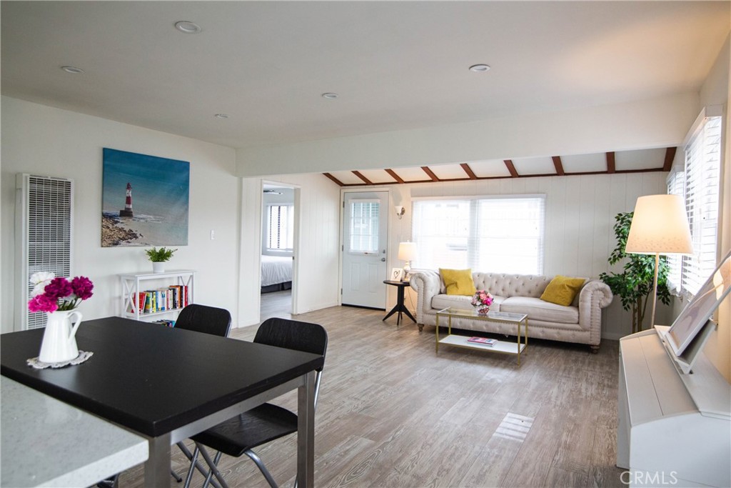 626 Eucalyptus Drive, Unit 1/2 El Segundo, CA 90245 - Photo 2 of 7 a living room with furniture and wooden floor