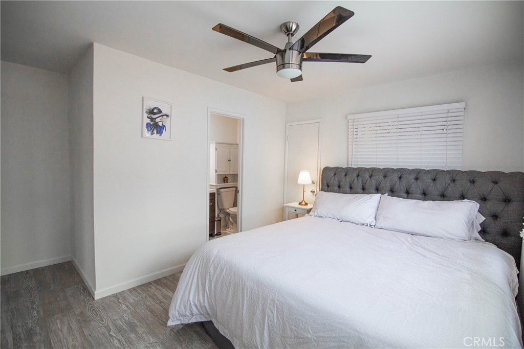 626 Eucalyptus Drive, Unit 1/2 El Segundo, CA 90245 - Photo 7 of 7 a bedroom with a large bed and a chandelier