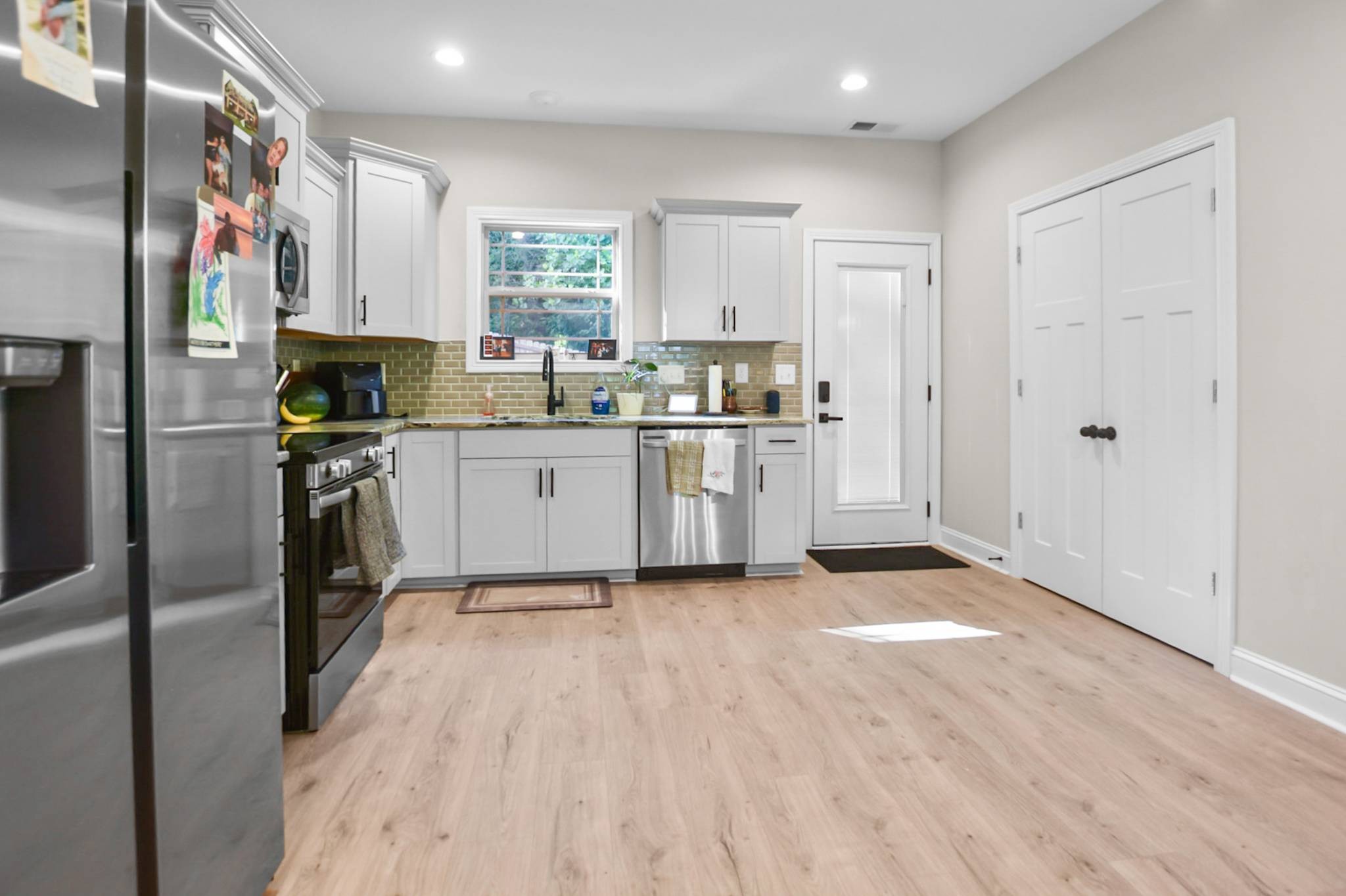 60 Cave Springs Road, Unit B Clarksville, TN 37042 - Photo 5 of 16 a kitchen with stainless steel appliances granite countertop a refrigerator and a sink