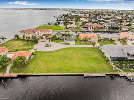 an aerial view of a pool patio swimming pool and outdoor seating