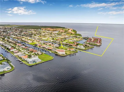 an aerial view of beach and ocean
