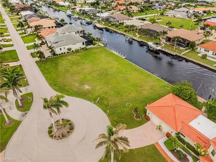 a view of a swimming pool with lawn chairs