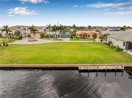 a view of a swimming pool with a lawn chairs