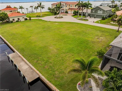 an aerial view of a house with a swimming pool