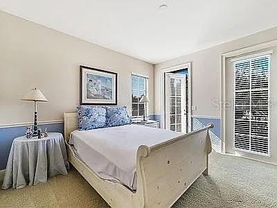 234 Acadia Terrace Celebration, FL 34747 - Photo 13 of 38 a bed room with a bed and a night stand