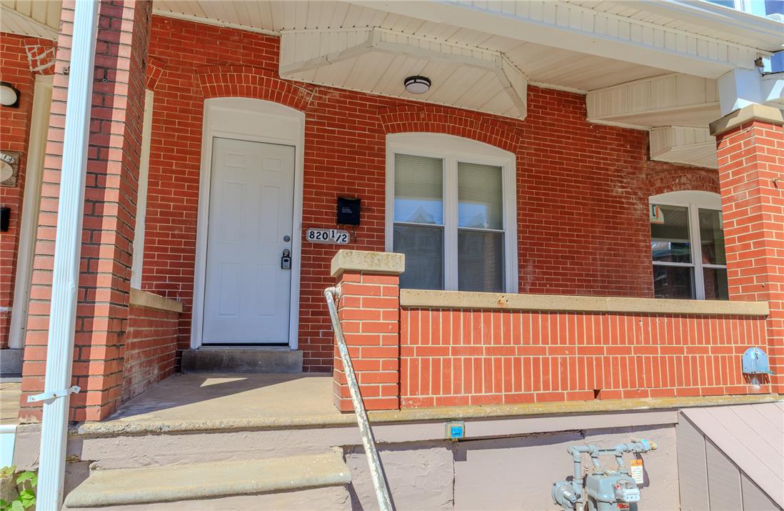 820 North 5th Street Allentown, PA 18102 - Photo 10 of 39 A classic brick facade welcomes you, showcasing enduring construction and a sheltered entry.
