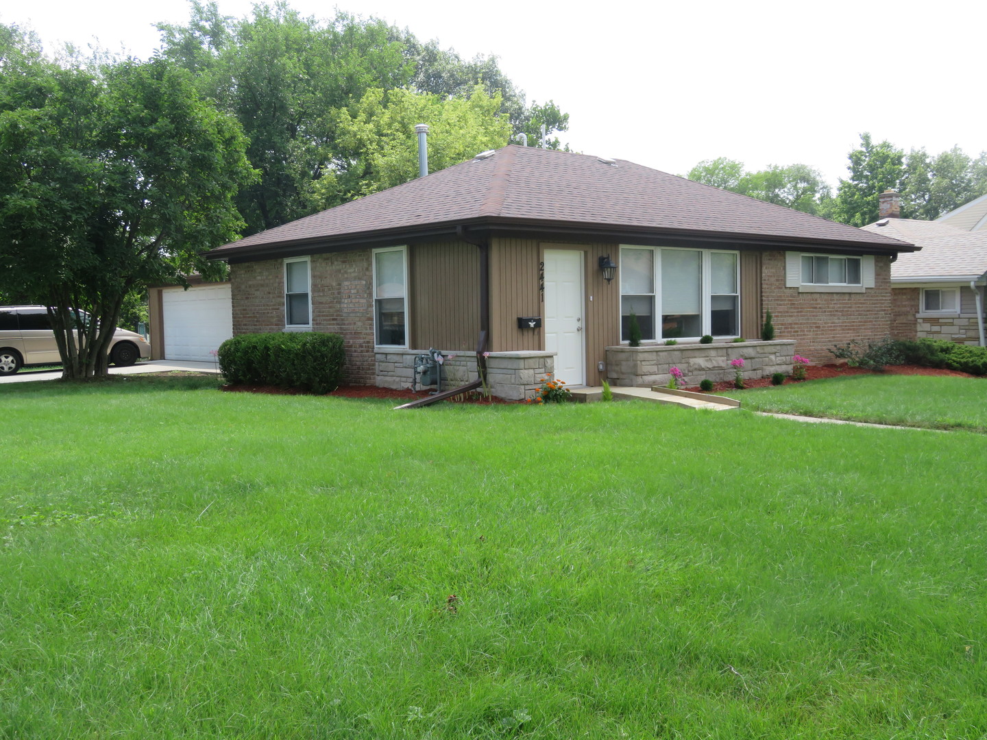 2441 Hawthorne Road Homewood, IL 60430 - Photo 1 of 23 a view of a house with a yard and sitting area