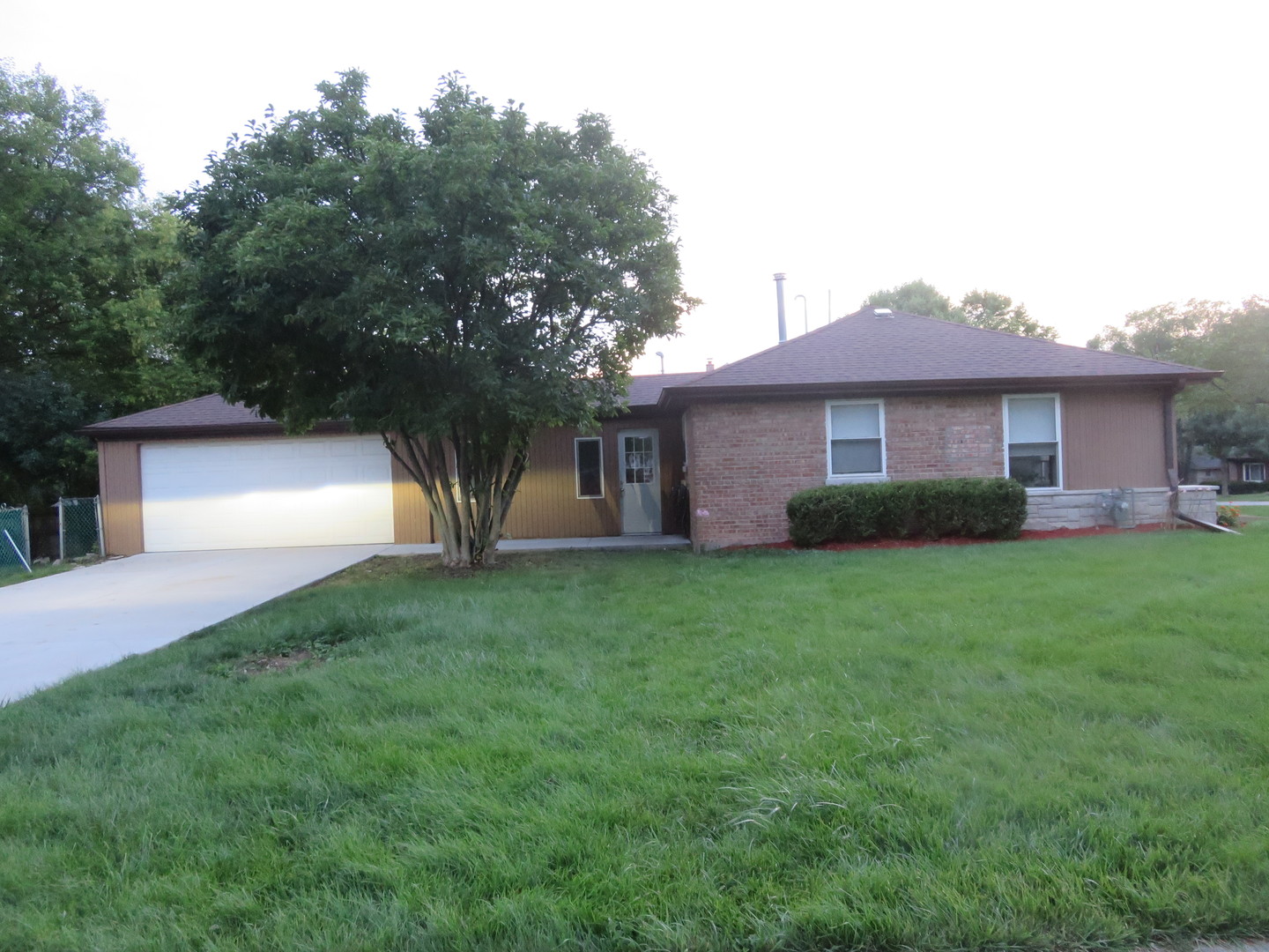 2441 Hawthorne Road Homewood, IL 60430 - Photo 22 of 23 a front view of a house with a yard and a garage