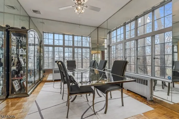 a view of a dining room with furniture window and outside view