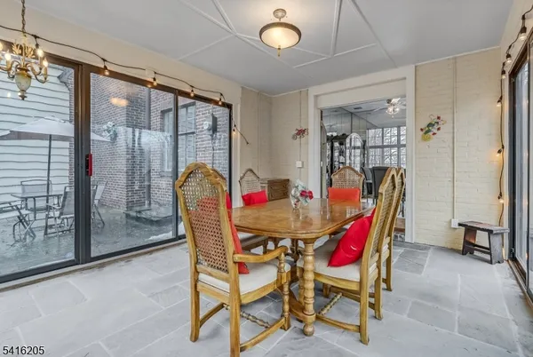 a dining room with furniture and window