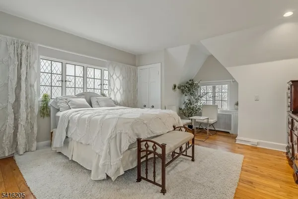 a bedroom with a bed and a table