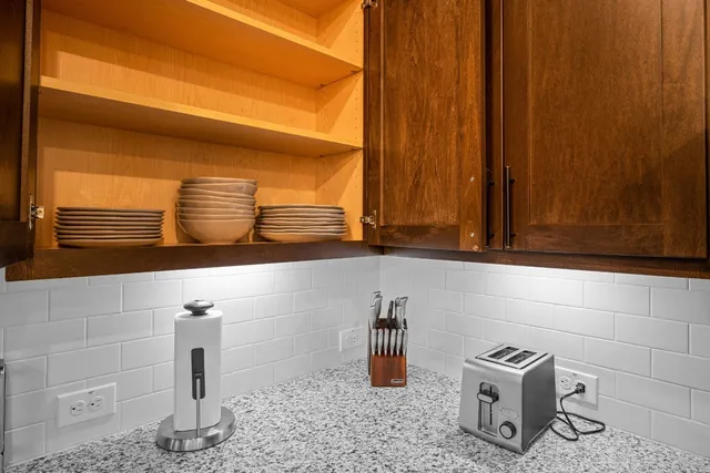 a bathroom with a sink a mirror and a shower