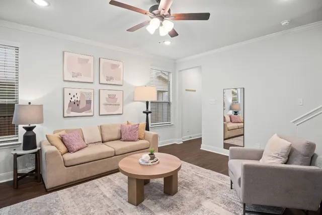a living room with furniture and a rug