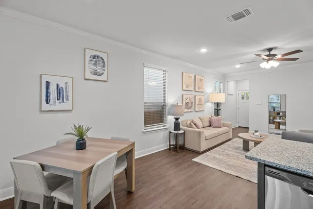 a living room with furniture and a table