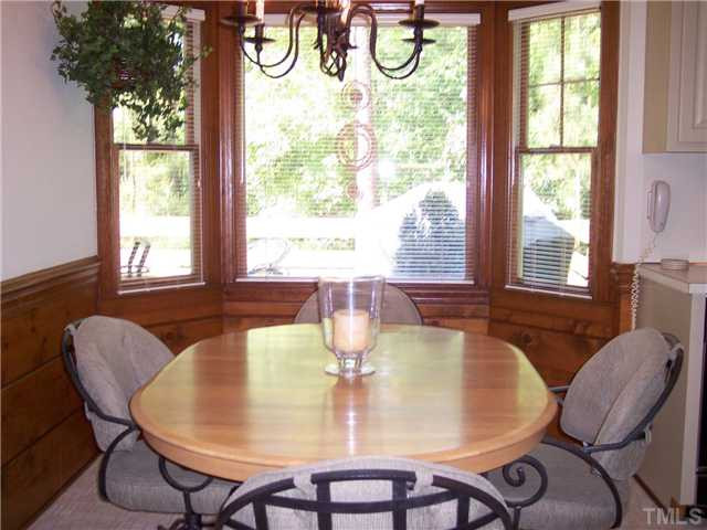 9321 Foxburrow Court Raleigh, NC 27613 - Photo 3 of 12 Sunny breakkfast nook overlooks amazing backyard. Breakfast Area
