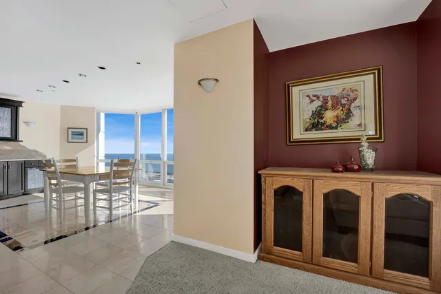 a view of a kitchen with furniture and wooden floor