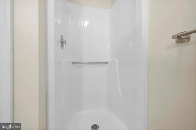 a bathroom with a glass shower door