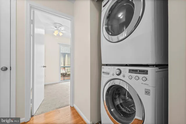 a view of a hallway with washer and dryer