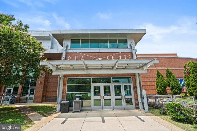 front view of a building with a garden