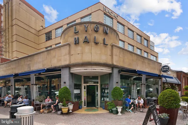 a view of a building with sitting area